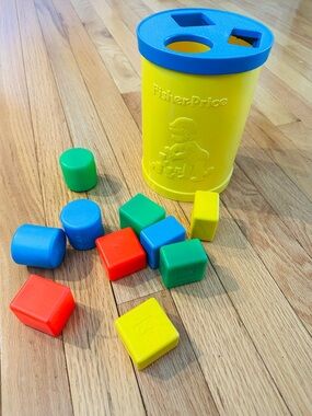 Vintage Fisher-Price Yellow and Blue Shape Sorter with Multi-Colored Blocks